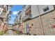 Modern townhouse exterior features balconies, white facade, and landscaped walkway at 5008 S Macdill Ave # 12, Tampa, FL 33611