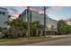 Modern gray multi-story home with palm trees and concrete accents, and a street view at dusk at 5008 S Macdill Ave # 12, Tampa, FL 33611