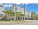 Condominium exterior surrounded by mature palm trees and manicured landscaping at 5008 S Macdill Ave # 12, Tampa, FL 33611