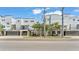 Modern white multi-story home with palm trees and concrete accents, with street view under blue sky at 5008 S Macdill Ave # 12, Tampa, FL 33611