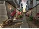 Exterior walkway between buildings, lined with rocks, plants, and modern design elements at 5008 S Macdill Ave # 12, Tampa, FL 33611