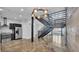 Modern living area with open staircase, stainless steel kitchen, and polished concrete floors at 5008 S Macdill Ave # 12, Tampa, FL 33611