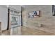 Spacious living area with concrete flooring, exposed brick, and balcony access, perfect for modern living at 5008 S Macdill Ave # 12, Tampa, FL 33611