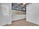 Open living area with industrial ceilings and an exposed brick wall, perfect for modern comfort at 5008 S Macdill Ave # 12, Tampa, FL 33611