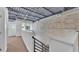 Unique loft space with exposed ceiling, brick walls, and great natural light from large windows at 5008 S Macdill Ave # 12, Tampa, FL 33611