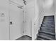 Modern stairway features white walls, contrasting stairs, and a sleek handrail leading to upper levels at 5008 S Macdill Ave # 12, Tampa, FL 33611