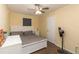Cozy bedroom featuring neutral walls, hardwood floors, and comfortable furnishings at 8318 Franklin Rd, Plant City, FL 33565