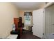 Bright bedroom with desk, wood floors, and natural light from the window at 8318 Franklin Rd, Plant City, FL 33565