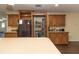 Spacious kitchen with a pantry, wood cabinets, stainless appliances, and a center island at 8318 Franklin Rd, Plant City, FL 33565