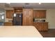 Well-equipped kitchen with wood cabinets, stainless steel appliances, and ample counter space at 8318 Franklin Rd, Plant City, FL 33565