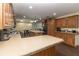 Large kitchen featuring two islands, wood cabinets, and an open concept layout at 8318 Franklin Rd, Plant City, FL 33565