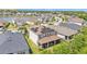Aerial view of the house with solar panels and the screened-in patio at 9015 Spruce Creek Cir, Riverview, FL 33578