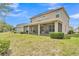 Lovely backyard with a screened patio and well-maintained lawn providing a peaceful outdoor space at 9015 Spruce Creek Cir, Riverview, FL 33578