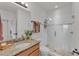 Bright bathroom features granite countertop, modern shower and bronze fixtures at 9015 Spruce Creek Cir, Riverview, FL 33578
