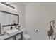 Stylish half bathroom featuring a sleek vanity, square sink, and elegant decor at 9015 Spruce Creek Cir, Riverview, FL 33578