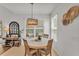 Cozy breakfast nook featuring a stylish table, seating, and an elegant chandelier with a view at 9015 Spruce Creek Cir, Riverview, FL 33578