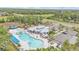 A high angle view of the community pool, outdoor lounge, and playground at 9015 Spruce Creek Cir, Riverview, FL 33578