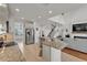 Bright kitchen with granite island and stainless steel refrigerator in an open layout at 9015 Spruce Creek Cir, Riverview, FL 33578