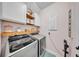 Practical laundry room with modern washer and dryer, shelving, and fresh decor at 9015 Spruce Creek Cir, Riverview, FL 33578