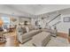 Spacious living room with a kitchen and staircase, perfect for entertaining at 9015 Spruce Creek Cir, Riverview, FL 33578