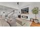 Open-concept living room featuring a modern fireplace and comfortable seating at 9015 Spruce Creek Cir, Riverview, FL 33578