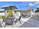 Relax on the backyard patio with an outdoor dining set, perfect for enjoying the outdoors and entertaining at 13032 Cumberland Dr, Largo, FL 33773