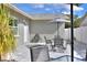 Relax on the backyard patio with an outdoor dining set, perfect for enjoying the outdoors and entertaining at 13032 Cumberland Dr, Largo, FL 33773