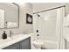 Bathroom featuring modern vanity, white subway tile and a bathtub with shower at 13032 Cumberland Dr, Largo, FL 33773
