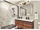 Modern bathroom with double sink vanity, framed mirror, and walk-in shower featuring black hardware at 13032 Cumberland Dr, Largo, FL 33773