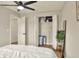 Bedroom with ceiling fan, closet and decoratively staged with ample room and natural light at 13032 Cumberland Dr, Largo, FL 33773