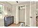 View of closet with storage shelves, lighting, and modern gray dresser at 13032 Cumberland Dr, Largo, FL 33773