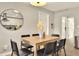Dining room has six chairs and is adjacent to the living room and the kitchen at 13032 Cumberland Dr, Largo, FL 33773