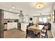 Open kitchen and dining area with stainless appliances and sight lines to a comfortable living room at 13032 Cumberland Dr, Largo, FL 33773