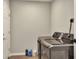 Laundry room features new washer and dryer units with light wood-look flooring at 13032 Cumberland Dr, Largo, FL 33773