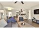 Stylish living room flows into the dining area and modern kitchen with stainless steel appliances at 13032 Cumberland Dr, Largo, FL 33773