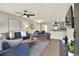 Open-concept living room featuring modern furnishings and hardwood floors at 13032 Cumberland Dr, Largo, FL 33773