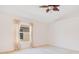 Bright and airy bedroom with a ceiling fan, neutral carpet, and a window with light-filtering curtains at 14385 Saltby Pl, Spring Hill, FL 34609