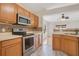 Kitchen featuring stainless steel appliances, oak cabinets, and an undermount sink at 14385 Saltby Pl, Spring Hill, FL 34609