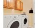 Convenient laundry room boasts modern washer and dryer at 14385 Saltby Pl, Spring Hill, FL 34609