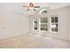 Spacious main bedroom features three windows, ceiling fan and carpet floors at 14385 Saltby Pl, Spring Hill, FL 34609