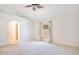 Spacious primary bedroom with carpet, window, and en-suite bathroom access at 14385 Saltby Pl, Spring Hill, FL 34609