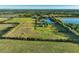 Expansive property features a private pond, lush landscaping, and mature trees, offering serene country living at 701 E 60 Hwy, Plant City, FL 33567