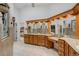Stunning bathroom with granite counters, dual sinks, a vanity, and a glimpse into the main bedroom at 701 E 60 Hwy, Plant City, FL 33567