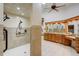 Elegant bathroom featuring a walk-in shower and a large vanity area with wood cabinets at 701 E 60 Hwy, Plant City, FL 33567