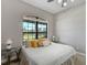 Light-filled bedroom with a picturesque outdoor view and soft, neutral decor at 701 E 60 Hwy, Plant City, FL 33567
