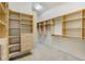 Large walk-in closet with custom organizers including adjustable shelving and drawers at 701 E 60 Hwy, Plant City, FL 33567