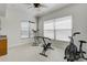 Bright exercise room equipped with fitness machines and large windows for a refreshing workout at 701 E 60 Hwy, Plant City, FL 33567