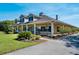 Beautiful home featuring a welcoming front porch with rocking chairs and manicured landscaping at 701 E 60 Hwy, Plant City, FL 33567