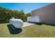 Exterior of the property featuring a GENERAC generator and large tank, indicating backup power and reliability at 701 E 60 Hwy, Plant City, FL 33567