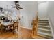 Open-concept foyer featuring beautiful hardwood floors and access to stairs and dining area at 701 E 60 Hwy, Plant City, FL 33567